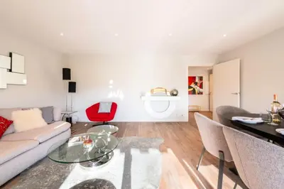 a living room with a couch and a table at Résidence Beau 3p, Vue Mer, Plages à Pied - Beau 3P, Vue Mer, Plages à pied MAE-3553 in Cannes