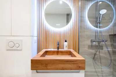 a bathroom with a wooden sink and a mirror at Résidence Beau 3p, Vue Mer, Plages à Pied - Beau 3P, Vue Mer, Plages à pied MAE-3553 in Cannes
