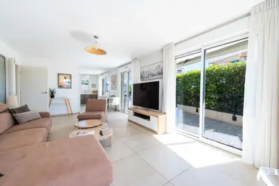 a living room with a couch and a tv at Résidence 4p Rooftop Avec Jacuzzi & Parking, Cannes - 4P Rooftop avec Jacuzzi & Parking, Cannes MAE-7563 in Cannes