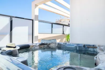 a swimming pool in the middle of a house at Résidence 4p Rooftop Avec Jacuzzi & Parking, Cannes - 4P Rooftop avec Jacuzzi & Parking, Cannes MAE-7563 in Cannes