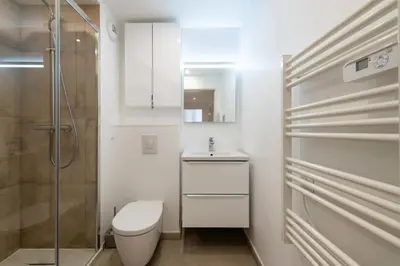 a bedroom with a large white bed and a window at Résidence 4p Rooftop Avec Jacuzzi & Parking, Cannes - 4P Rooftop avec Jacuzzi & Parking, Cannes MAE-7563 in Cannes