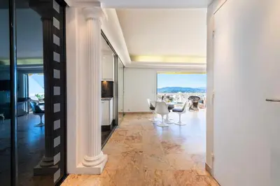 an open living room with a table and chairs at Résidence 3p Vue Panoramique - Dernier Étage, Cannes - 3P Vue Panoramique - Dernier Étage, Cannes MAE-3933 in Cannes