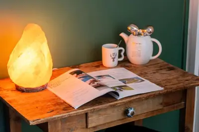 a table with a book and a vase and a magazine at Résidence Studio Dernier étage – Centre Cannes - Studio dernier étage – Centre Cannes MAE-3943 in Cannes