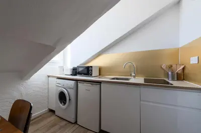 a kitchen with a sink and a washing machine at Résidence Studio Dernier étage – Centre Cannes - Studio dernier étage – Centre Cannes MAE-3943 in Cannes