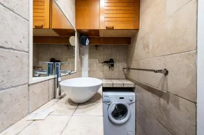 a bathroom with a washing machine and a sink at Résidence 2p Proche Plage Et Croisette, Palm Beach - 2P Proche Plage et Croisette, Palm Beach MAE-2193 in Cannes