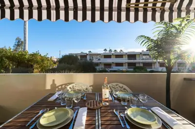 a dining table with a view of a building at Résidence 2p Proche Plage Et Croisette, Palm Beach - 2P Proche Plage et Croisette, Palm Beach MAE-2193 in Cannes