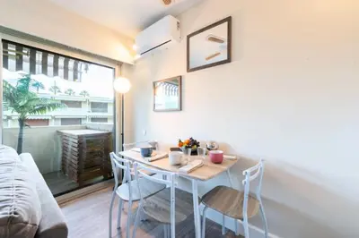 a small dining room with a table and chairs at Résidence 2p Proche Plage Et Croisette, Palm Beach - 2P Proche Plage et Croisette, Palm Beach MAE-2193 in Cannes