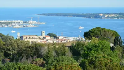 a city street with a building with paintings on it at Executive 2BR Apartment near Croisette Ideal for MIPIM Terrace & Wi-Fi in Cannes