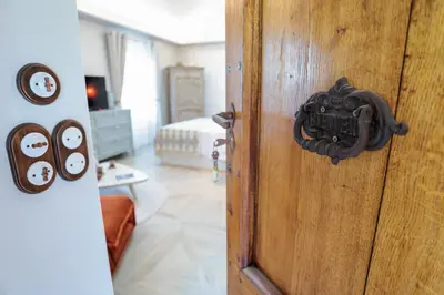 a door to a bedroom with a bed in a room at Charmant studio dans la Californie in Cannes