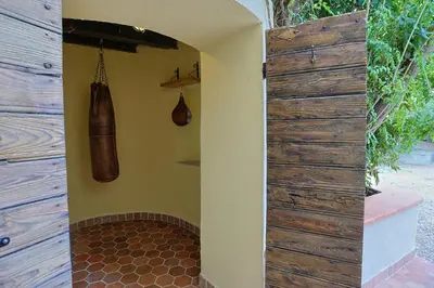 a bathroom with a wooden wall and a shower stall at Charmant studio dans la Californie in Cannes