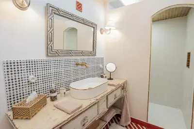 a bathroom with a sink and a mirror at Charmant studio dans la Californie in Cannes