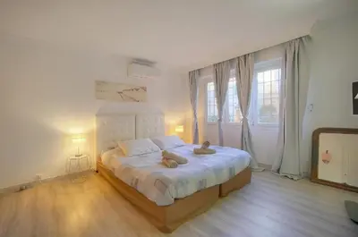 a bedroom with a bed with two teddy bears on it at Cannes Sunset & Sea Apartment in Cannes
