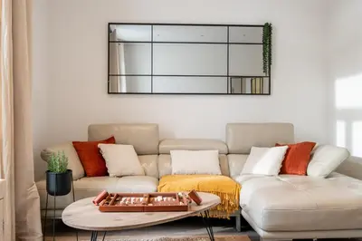 a living room with a couch and a table at Hyper centre Cannes - 2 pièces avec balcon - 4 couchages in Cannes
