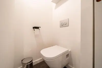 a white bathroom with a white toilet in it at Hyper centre Cannes - 2 pièces avec balcon - 4 couchages in Cannes