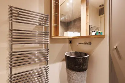 a bathroom with a trash can and a mirror at 5 Croisette 6 in Cannes