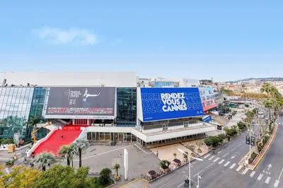 an overhead view of a busy city street with a billboard at 5 Croisette 6 in Cannes
