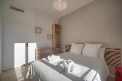 a bedroom with a bed with towels on it at MAISON DE VILLE 6 Chambres TERRASSE -Stanislas Chic A6B002 in Cannes