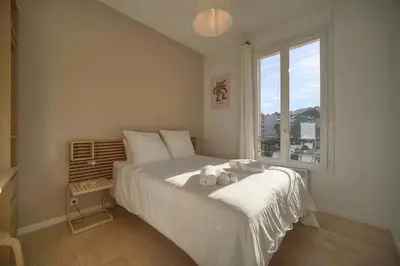 a bedroom with a bed with two towels on it at MAISON DE VILLE 6 Chambres TERRASSE -Stanislas Chic A6B002 in Cannes