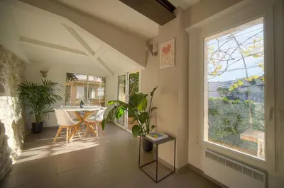 a dining room with a table and a window at MAISON DE VILLE 6 Chambres TERRASSE -Stanislas Chic A6B002 in Cannes