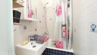 a bathroom with a sink and a shower at Studio Forville in Cannes