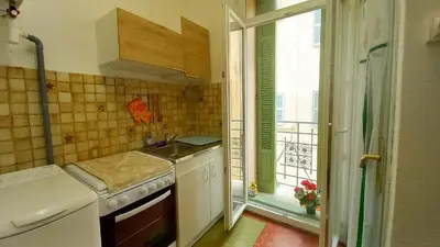 a kitchen with a sink and a window with a view at Studio Forville in Cannes