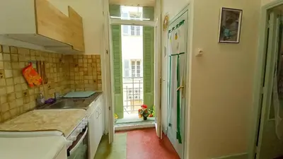 a kitchen with a sink and a window at Studio Forville in Cannes