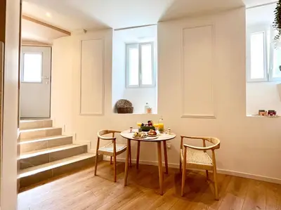 a dining room with a table and two chairs at Le Borniol in Cannes