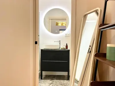 a bathroom with a sink and a mirror at Le Borniol in Cannes