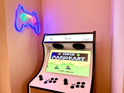 a game machine with a gun and a game controller at Le Borniol in Cannes
