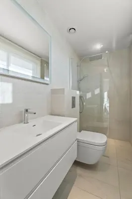 a bathroom with a toilet and a sink and a shower at REF 2033 - Cannes - Sumptuous penthouse with sea view for rent in Cannes