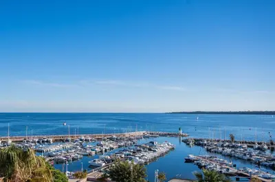 a marina filled with lots of boats in the water at REF 2033 - Cannes - Sumptuous penthouse with sea view for rent in Cannes