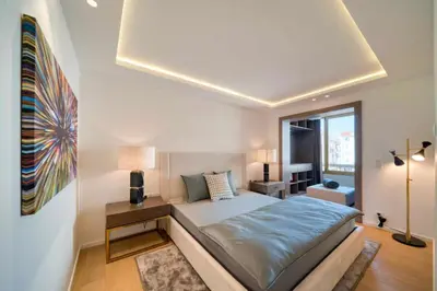 a bedroom with a large bed and a window at REF 1295 - Cannes Croisette - Sea view apartment for rent in Cannes