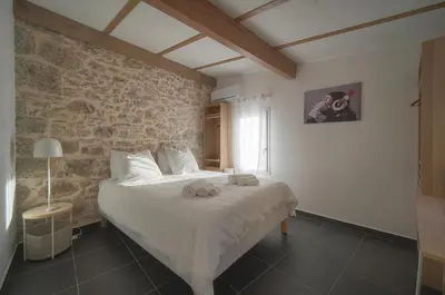 a bedroom with a bed with two stuffed animals on it at DUPLEX 3 Chambres TERRASSE et 1 DEPENDANCE A4B026 in Cannes