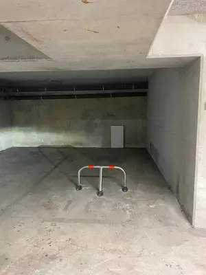 an empty parking garage with a metal rack in it at L'AZUERA Cannes center 2P Design 4 Pers Secure Parking in Cannes