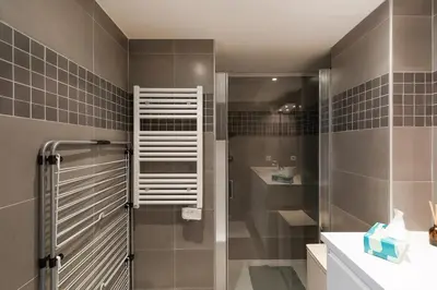 a bathroom with a shower and a sink at L'AZUERA Cannes center 2P Design 4 Pers Secure Parking in Cannes