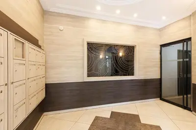 a dressing room with a painting on the wall at L'AZUERA Cannes center 2P Design 4 Pers Secure Parking in Cannes