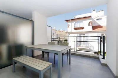 a table and bench on a balcony with a view at L'AZUERA Cannes center 2P Design 4 Pers Secure Parking in Cannes