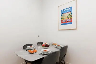 a table with plates and bowls of food on it at Immogroom - 1Bedroom - CityCenter - AC in Cannes