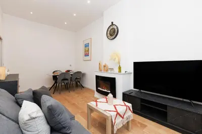 a living room with a couch and a fireplace at Immogroom - 1Bedroom - CityCenter - AC in Cannes