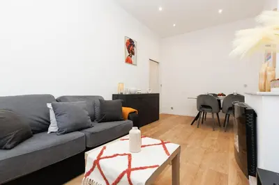 a living room with a couch and a table at Immogroom - 1Bedroom - CityCenter - AC in Cannes