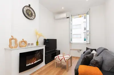 a living room with a couch and a fireplace at Immogroom - 1Bedroom - CityCenter - AC in Cannes