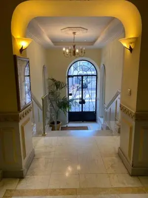 a hallway with a large door in a house at Trois pièces Gallieni in Cannes