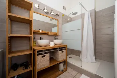 a bathroom with two sinks and a shower at Spacious and Bright Near Train Station and Palais des Festivals - BENAKEY in Cannes