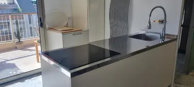 a kitchen with a sink and a counter top at Magnifique deux pièces Lacour in Cannes