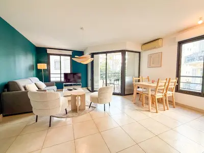 a bathroom with a toilet and a glass shower at Charming Terrace Apartment with Garden Views - Cannes City Center in Cannes