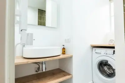 a bathroom with a sink and a mirror at Résidence Rare ! Duplex De Style En Plein Centre Ville - RARE ! Duplex de style en plein centre ville MAE-5823 in Cannes