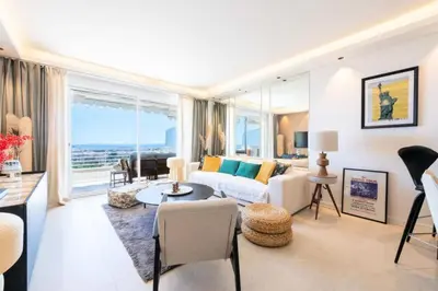 a living room with a couch and a table at Résidence 3p Terrasse Vue Mer – Résidence De Standing - 3P Terrasse Vue Mer – Résidence de Standing MAE-3293 in Cannes