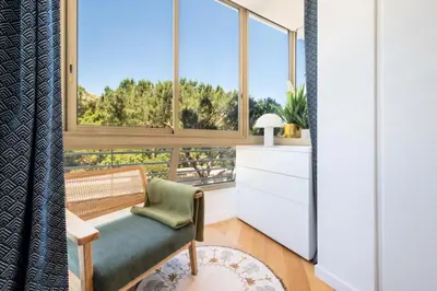 a living room with a bench and large windows at Résidence 3p Terrasse Vue Mer – Résidence De Standing - 3P Terrasse Vue Mer – Résidence de Standing MAE-3293 in Cannes