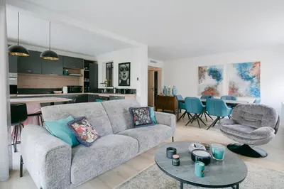 a living room with a couch and a table at Blue Dream in Le Cannet