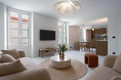 a living room with a couch and a table at Maya Cannes in Cannes